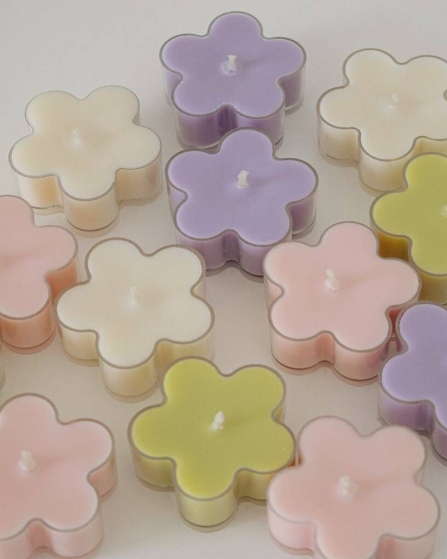 Nine-piece Blossom floral scented tea-light candles, handcrafted from pure soy wax, ideal for peaceful meditation ambience and intimate dinner decor.