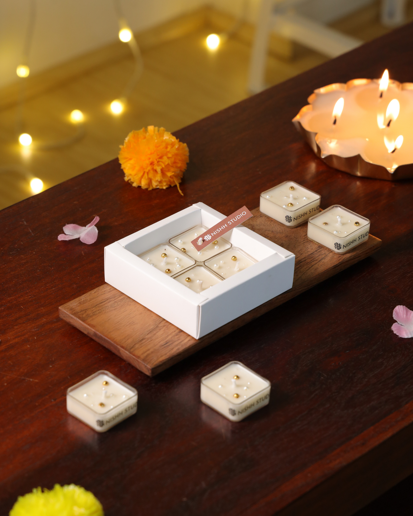 Handcrafted soy wax tealight candles from Nishh’s Mukta collection – smokeless and decorative.