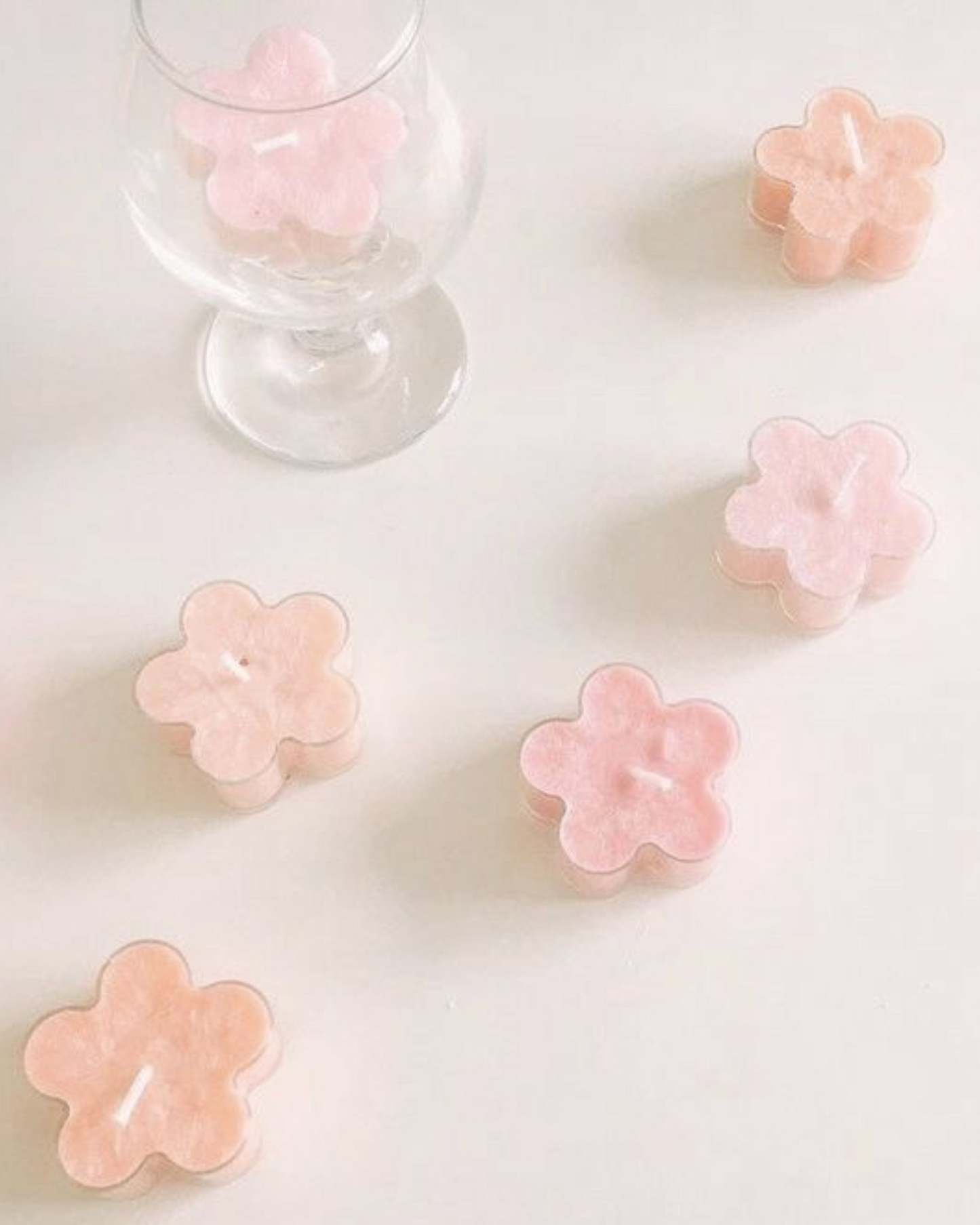 Hand-made flower-shaped scented tea-light candles from the Blossom series by Nishh—elegant artisanal candles for gifting, festive decor, and soothing fragrance.