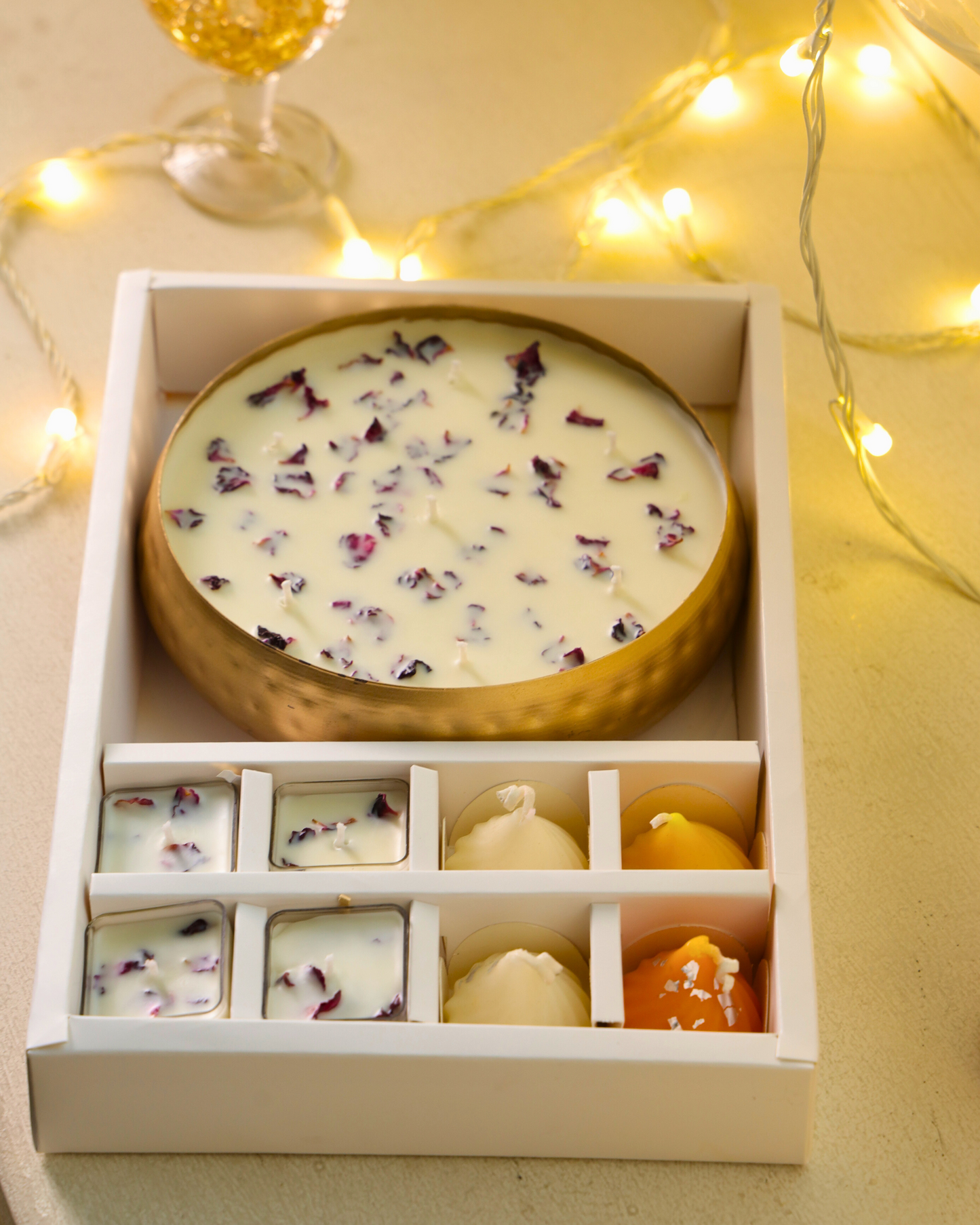 Four laddoo/modak candles symbolizing prosperity and festivity – part of Gulpatra Luxe Gift Hamper.