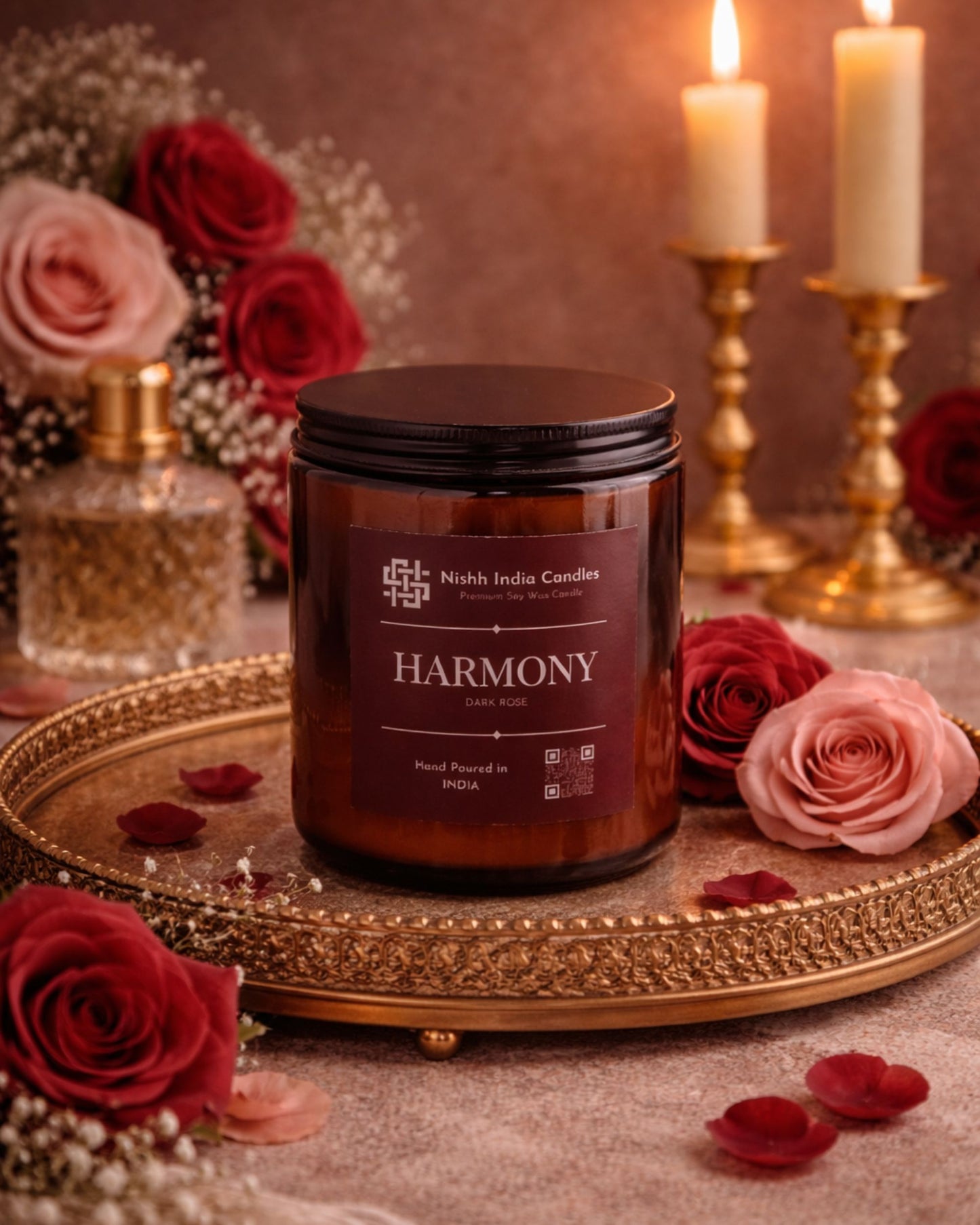 Luxury dark rose candle in amber jar styled on marble surface with soft neutral tones, premium romantic home decor fragrance.