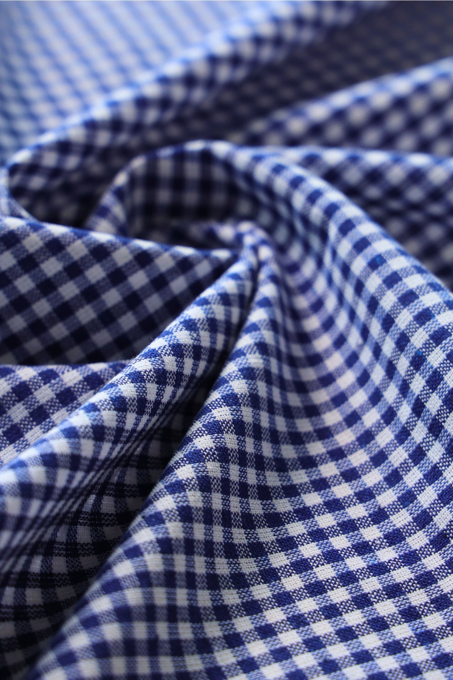 Close-up of blue gingham cotton fabric texture for curtains
