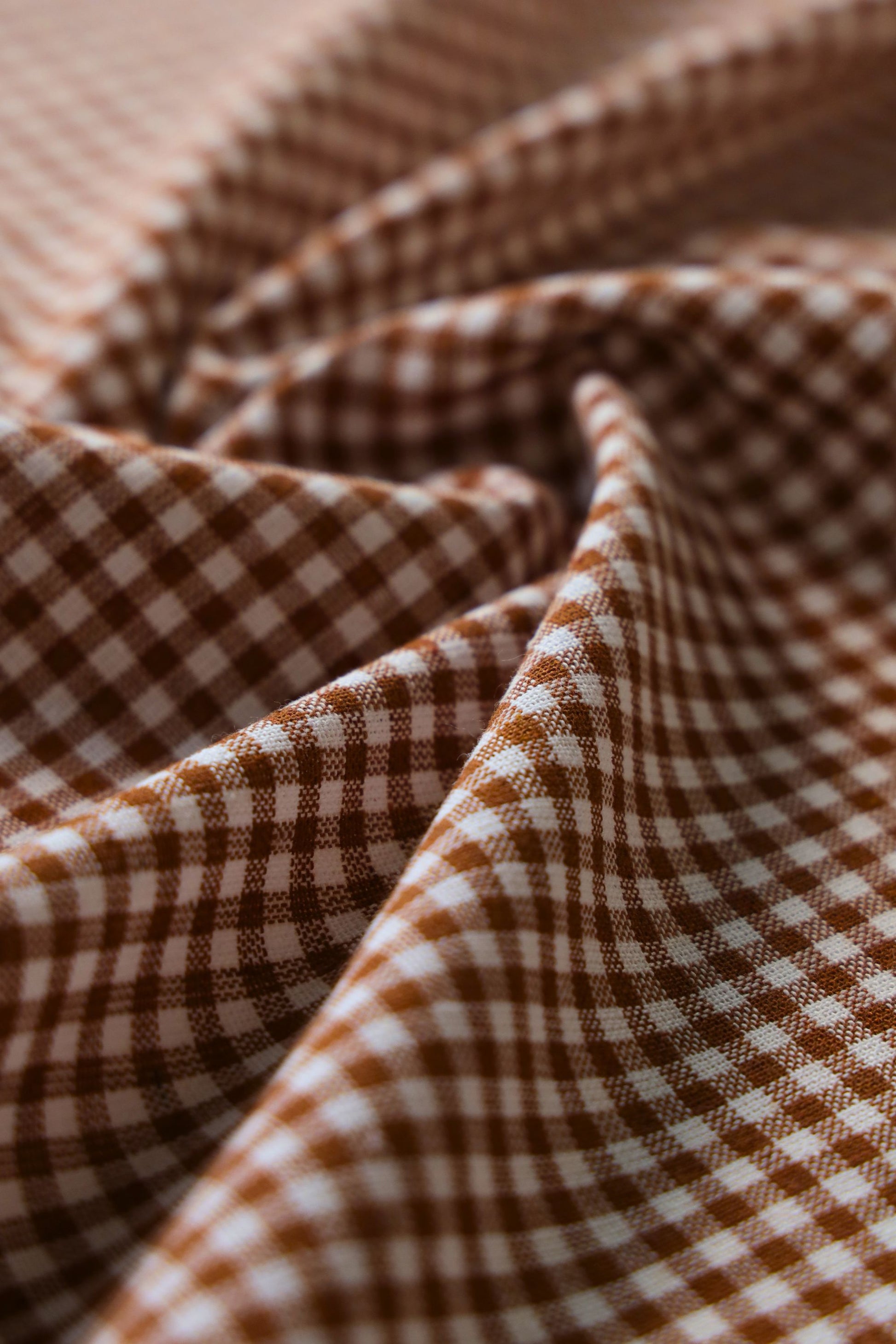 Close-up of brown and white checkered fabric