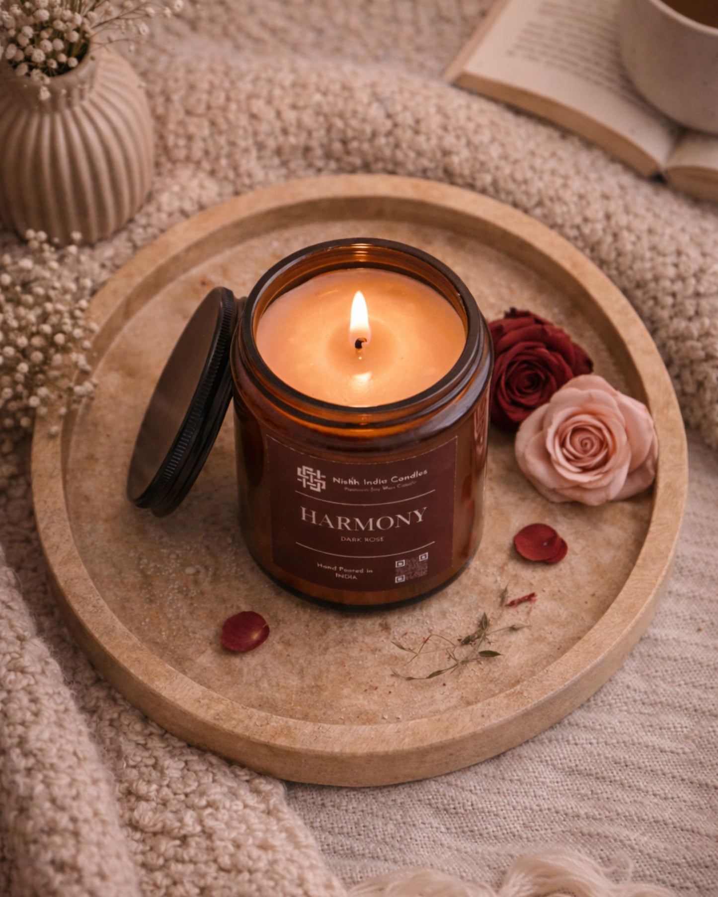 Top view of dark rose scented soy candle in amber jar, premium handmade luxury home fragrance by Nishh India.