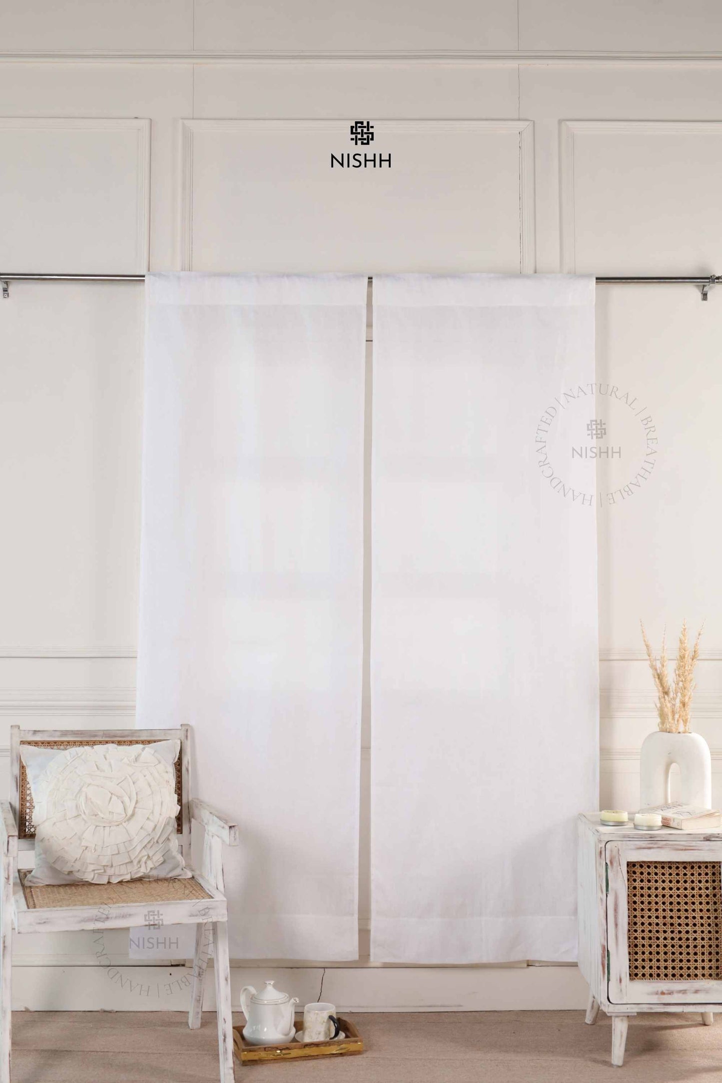 Edith linen drapes with rod pocket hanging in a minimalist living room