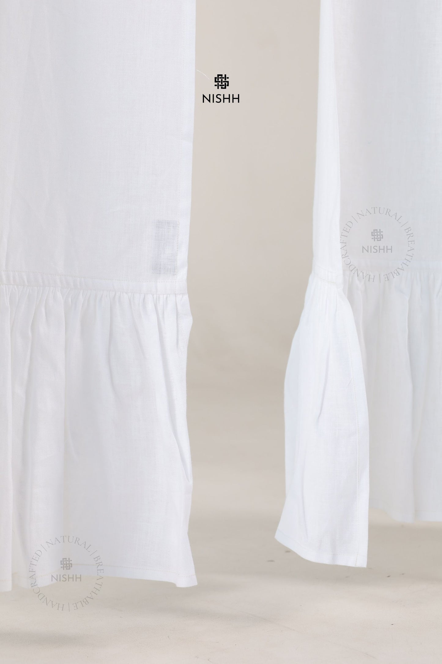 Close up of premium linen fabric used in Élan drapes, breathable natural linen curtains with soft folds