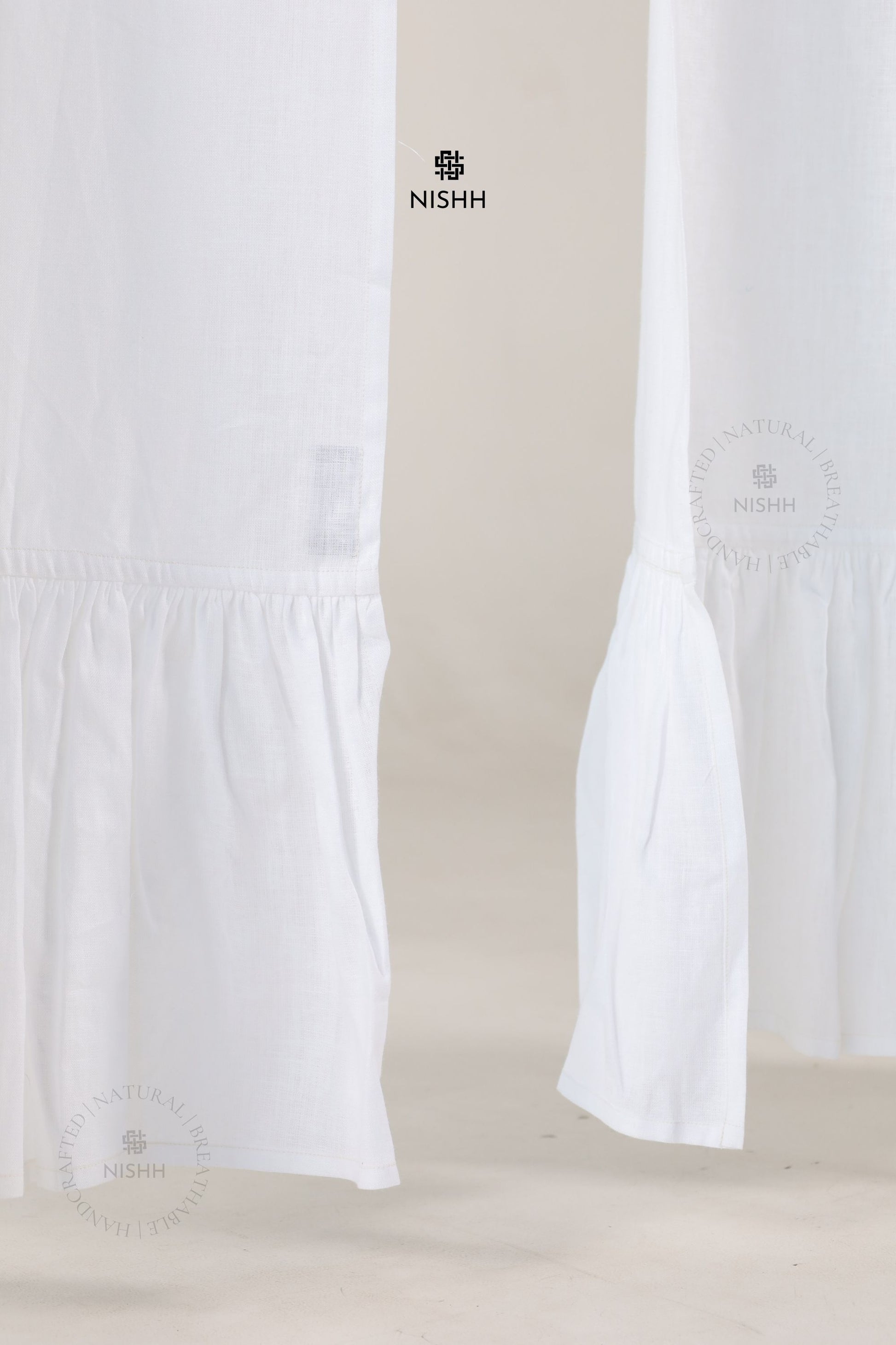 Close up of premium linen fabric used in Élan drapes, breathable natural linen curtains with soft folds