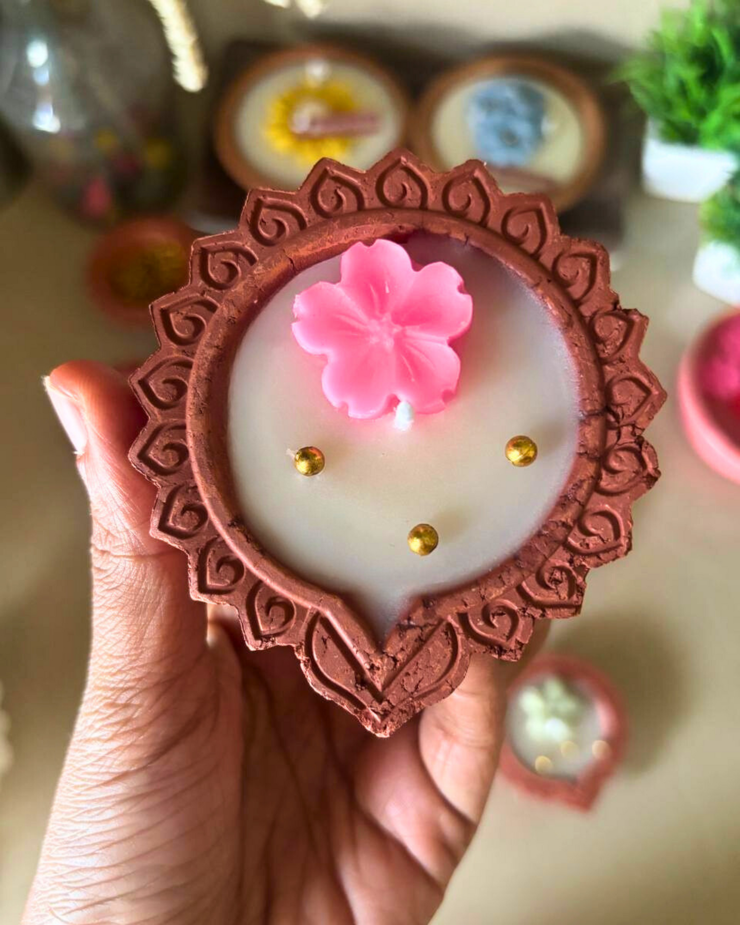 Handcrafted floral diya candle made of soy wax – perfect for Diwali and festive décor.