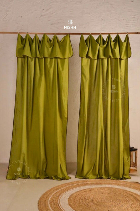 Pair of green poplin curtains with ruffled top