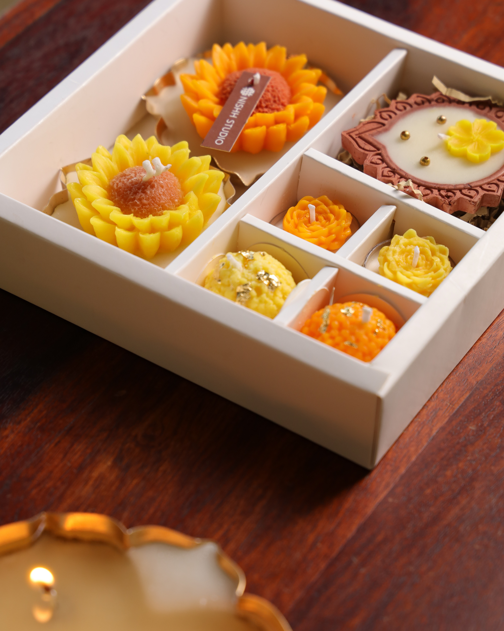 Two modak-shaped candles symbolizing prosperity – part of Arka festive hamper.