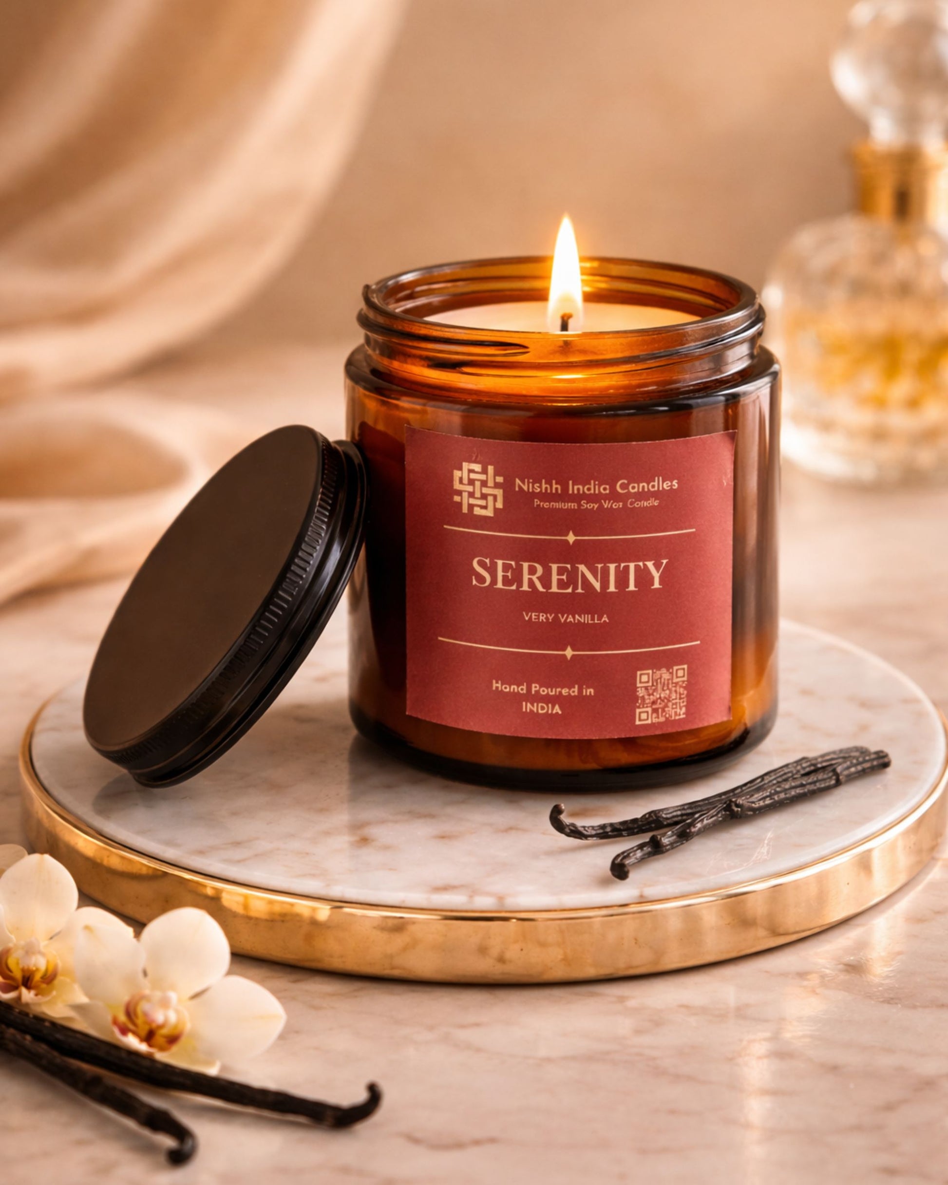 Serenity Very Vanilla amber jar soy wax candle styled in minimal luxury home decor with marble surface and soft neutral backdrop.