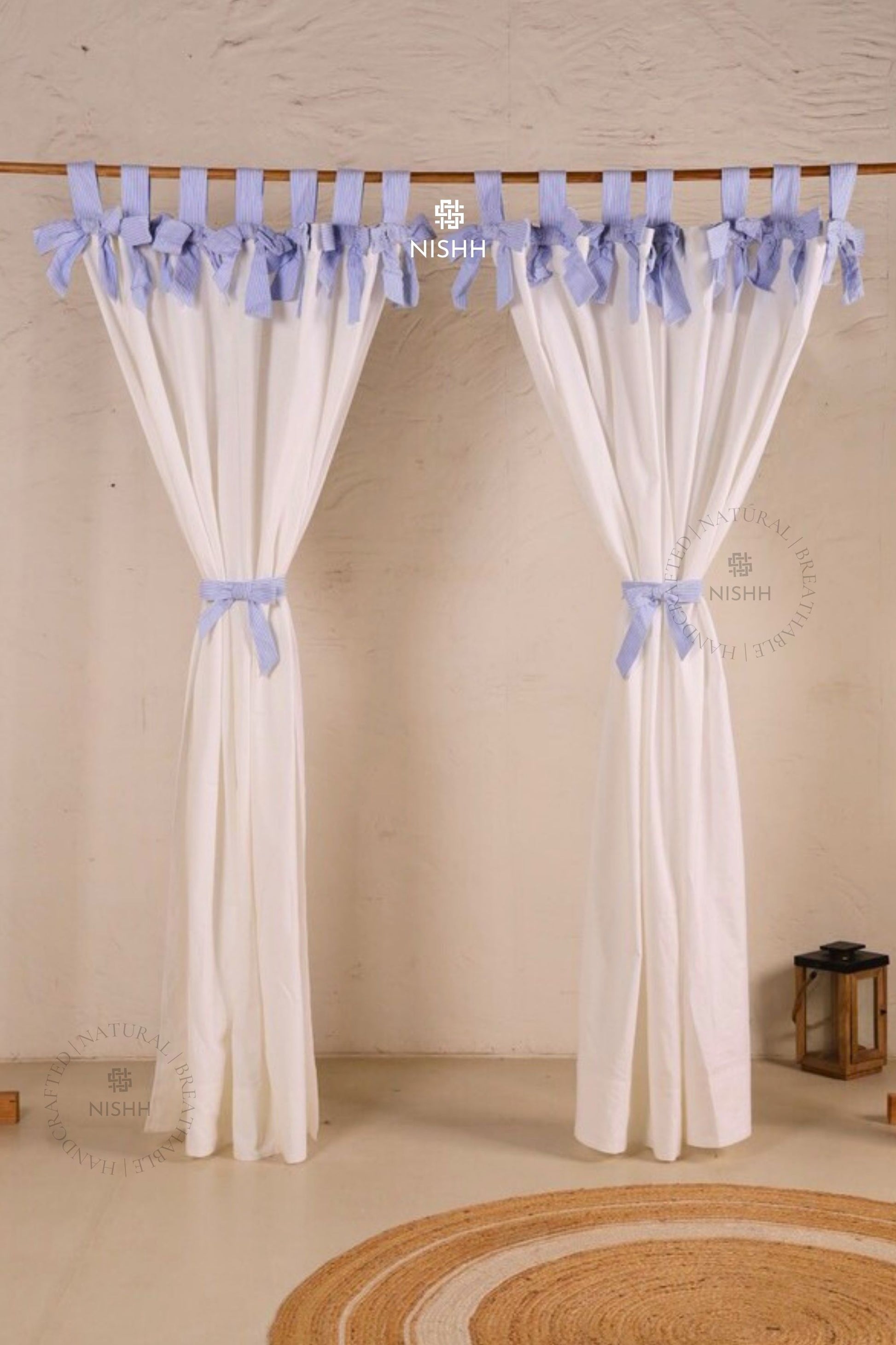  White linen curtains styled in a modern minimalist living space