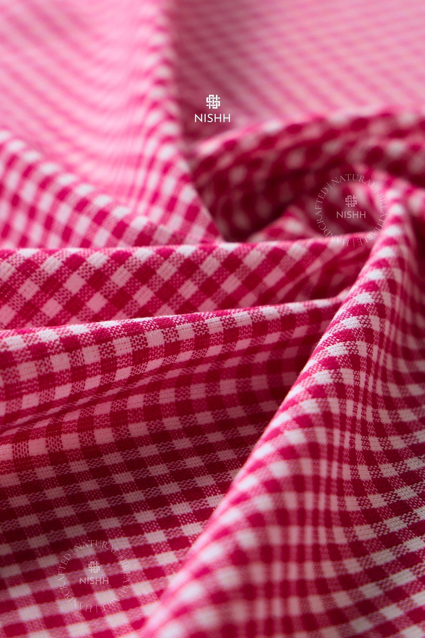 Close-up of red and white checkered cotton gingham fabric