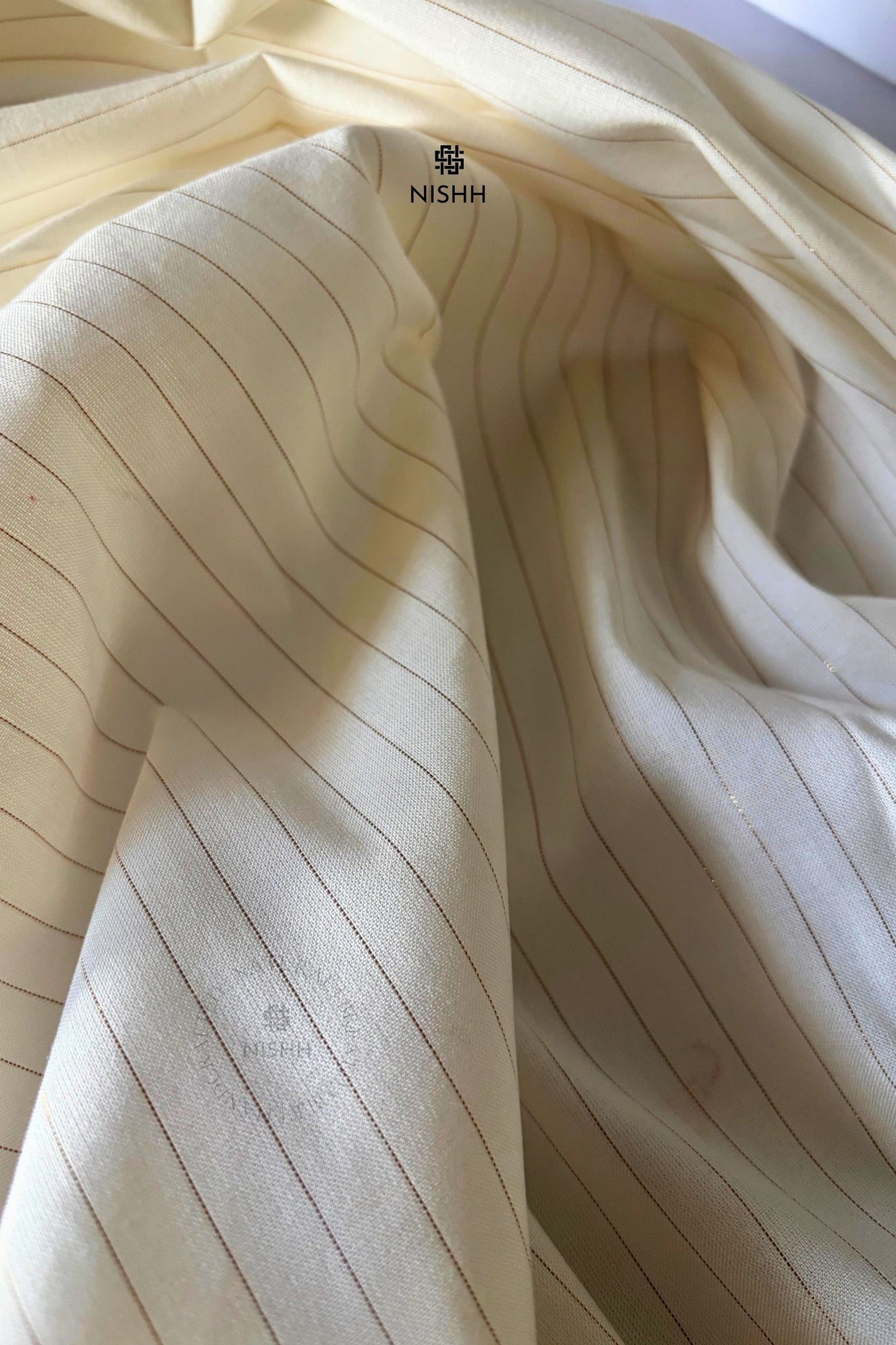 Cotton fabric texture with delicate zari accents on Whisper drapes