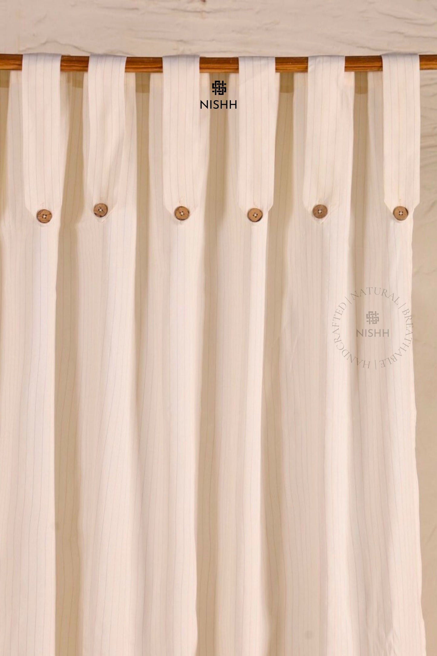 Whisper cotton zari drapes filtering soft natural light in a calm interior