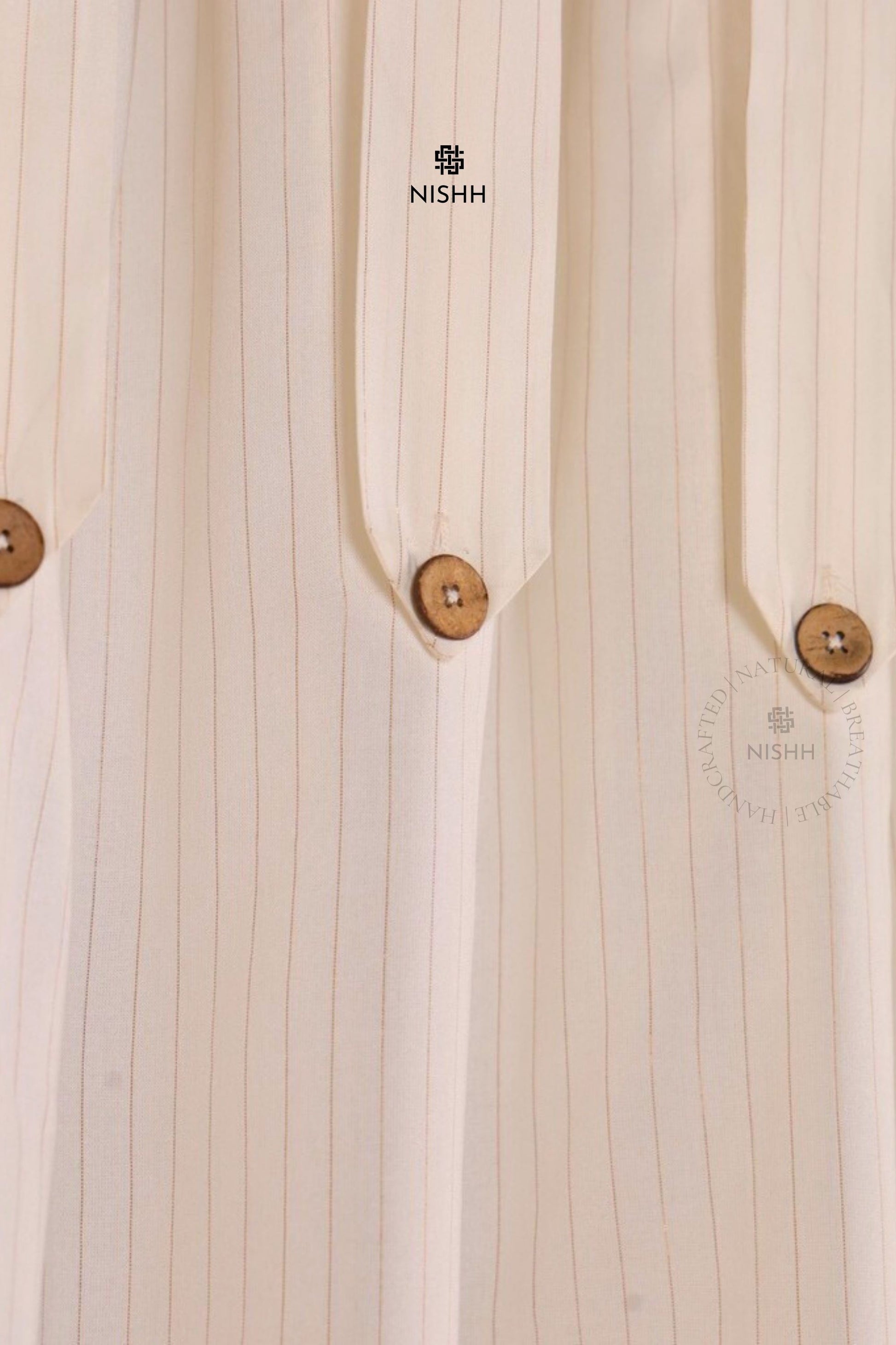 Whisper cotton zari drapes styled in a minimal and serene home setting