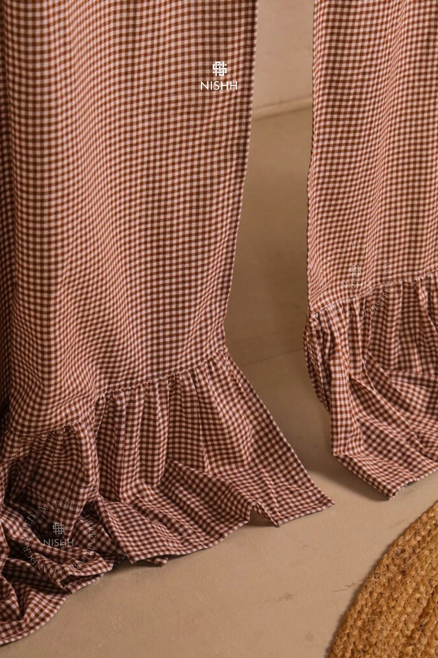Ruffled hem detail of handcrafted Willow gingham curtain